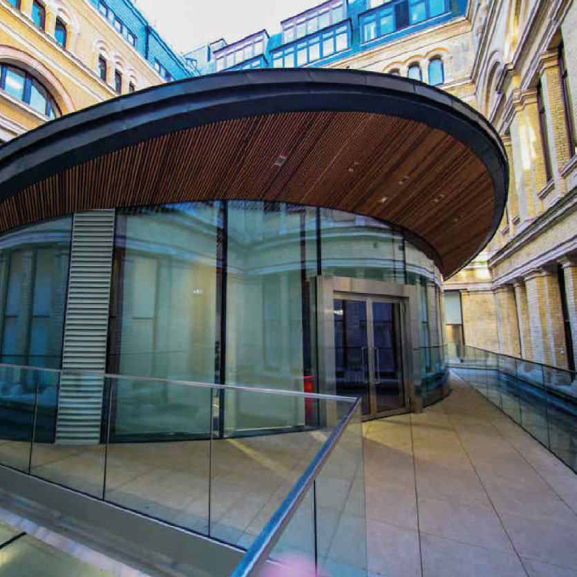 Exterior of the Mayhew lecture we project managed construction of for the Diplomatic Academy at FCO’s offices in King Charles Street (KCS). A modern curved building formed from a series of glass panes, coated with a solar control technical to help reduce the amount of radiant heat within the theatre.